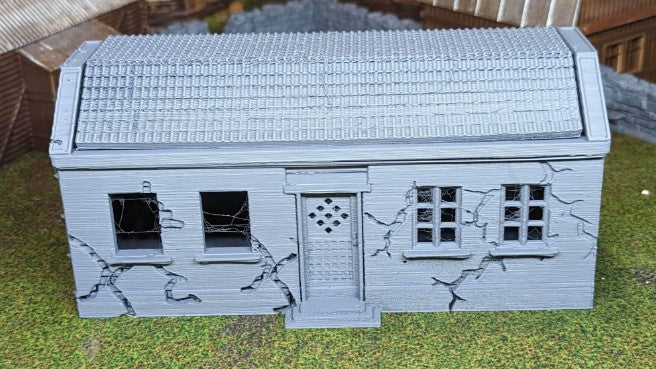 Destroyed house with removable roof